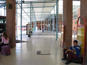 man sitting at bus station